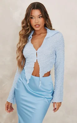 Baby Blue Textured Dip Hem Flute Sleeve Shirt