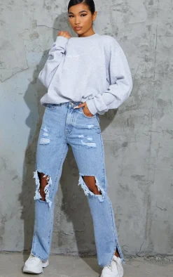 Light Blue Wash Ripped Open Knee Split Hem Jeans