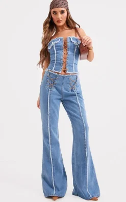Mid Blue Wash Frayed Detail Lace Up Flared Denim Jeans