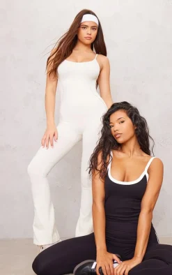 PLT SPORT Bone Seamless Laser Cut Strappy Gym Flare Unitard