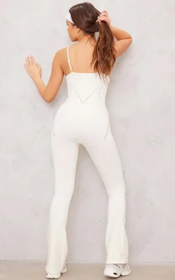 PLT SPORT Bone Seamless Laser Cut Strappy Gym Flare Unitard