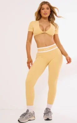 PLT SPORT Peach Sculpt Twist Front Contrast Detail Open Back Crop Top