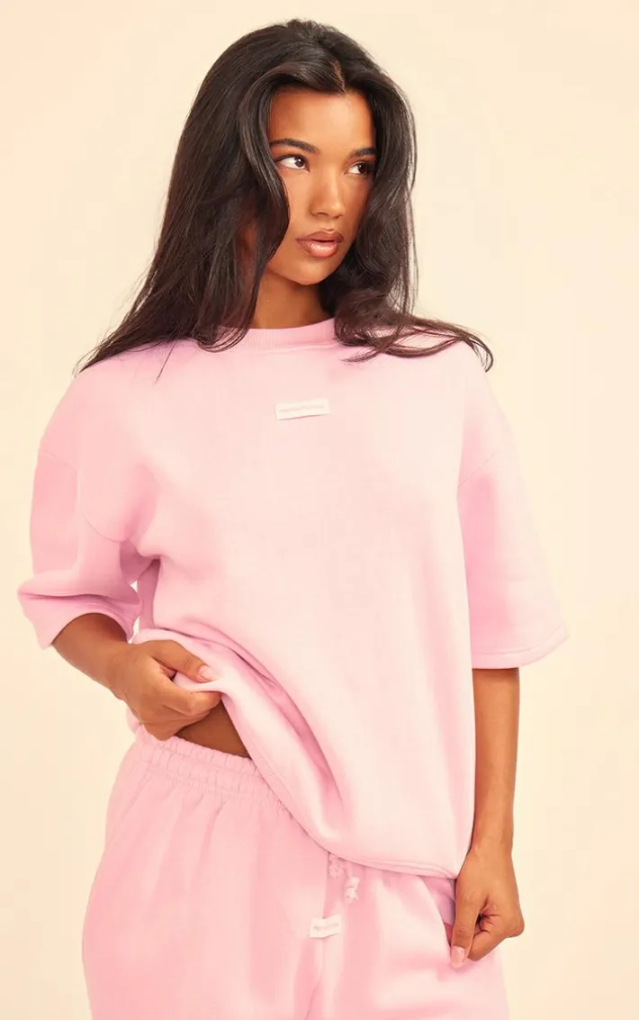 PRETTYLITTLETHING Baby Pink Badge Detail Mid Rise Wide Leg Sweatpants