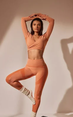 PRETTYLITTLETHING Burnt Orange Sport Seamless Cross Front Long Sleeve Crop Top