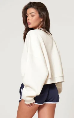 PRETTYLITTLETHING Cream Athletics Club Embossed Oversized Boxy Sweatshirt