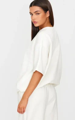 PRETTYLITTLETHING Cream Badge Detail Oversized Short Sleeve Sweatshirt