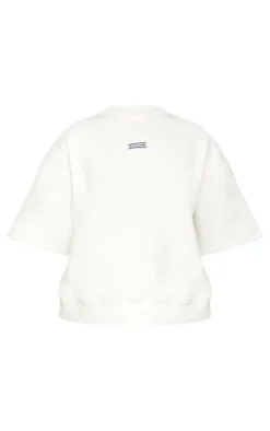 PRETTYLITTLETHING Cream Badge Detail Oversized Short Sleeve Sweatshirt