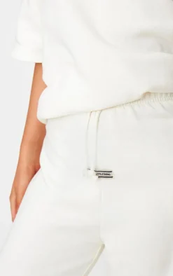 PRETTYLITTLETHING Cream Badge Detail Mid Rise Wide Leg Sweatpants