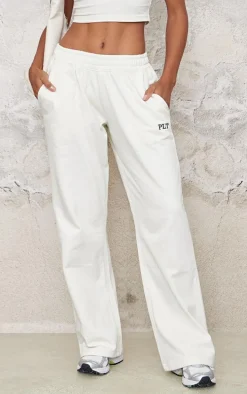 PRETTYLITTLETHING Cream Contrast Embroidery Wide Leg Low Rise Sweatpants