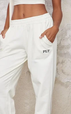 PRETTYLITTLETHING Cream Contrast Embroidery Wide Leg Low Rise Sweatpants