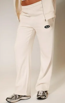 PRETTYLITTLETHING Cream Contrast Logo Badge Wide Leg Sweatpants