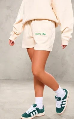 PRETTYLITTLETHING Cream Embroidered Country Club Washed Sweat Shorts