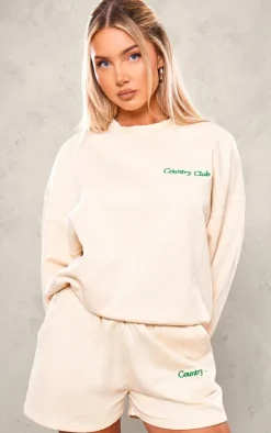 PRETTYLITTLETHING Cream Embroidered Country Club Washed Sweat Shorts
