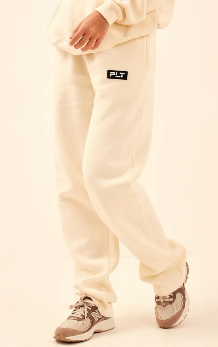PRETTYLITTLETHING Cream Logo Badge Detail Straight Leg Sweatpants