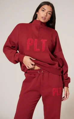 PRETTYLITTLETHING Dark Red Borg Applique Quarter Zip Sweatshirt