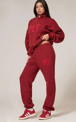 PRETTYLITTLETHING Dark Red Borg Applique Cuffed Sweatpants