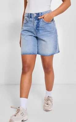 PRETTYLITTLETHING Mid Blue Wash Raw Hem Longline Loose Fit Denim Shorts