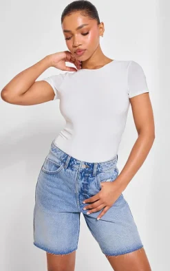 PRETTYLITTLETHING Mid Blue Wash Raw Hem Longline Loose Fit Denim Shorts