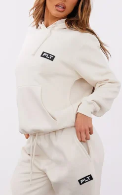 PRETTYLITTLETHING Petite Cream Badge Detail Straight Leg Sweatpants