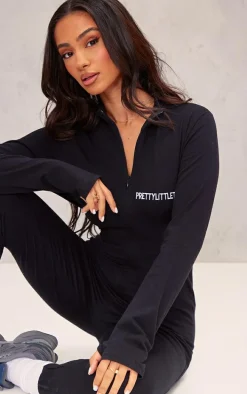 PRETTYLITTLETHING Petite Black Embroidered Zip Front Catsuit