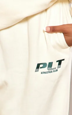 PRETTYLITTLETHING Plus Cream Athletics Club Embroidered Wide Leg Sweatpants