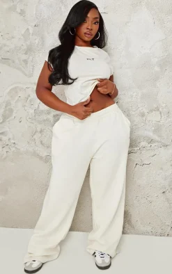 PRETTYLITTLETHING Plus Cream Contrast Embroidery Fitted Cap Sleeve T Shirt