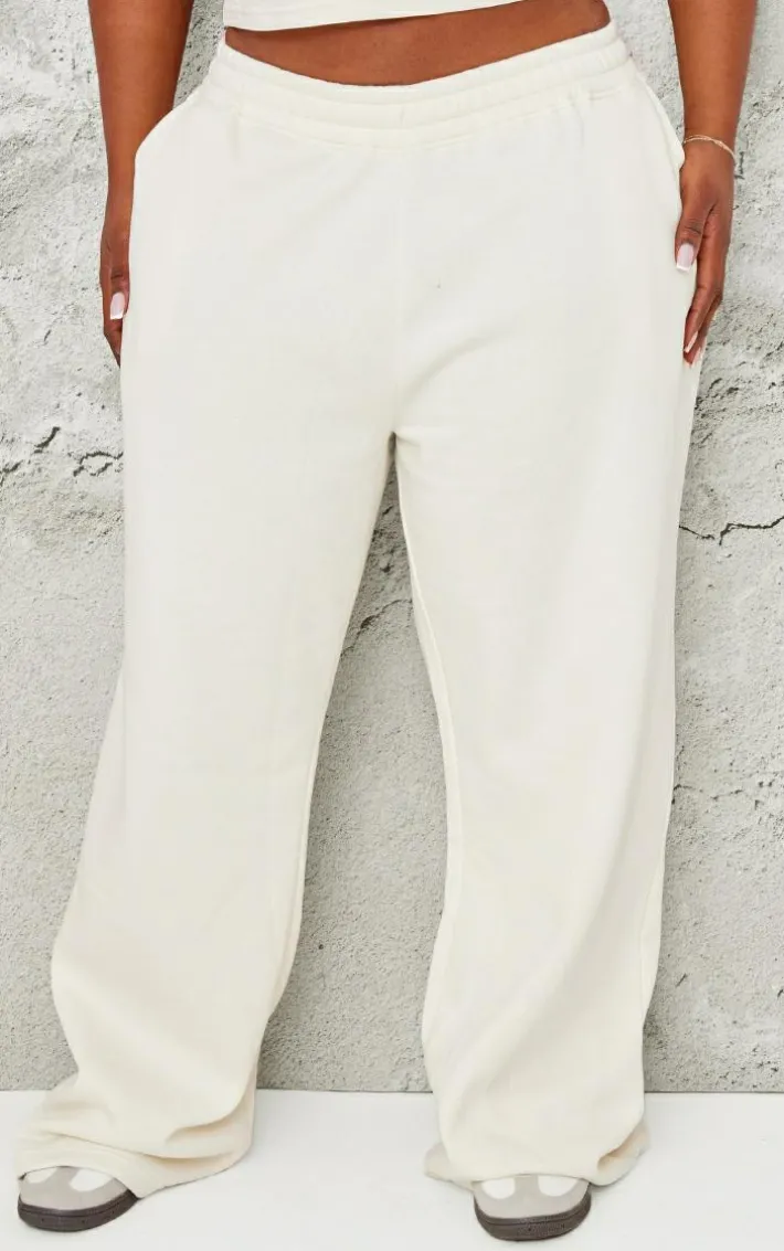 PRETTYLITTLETHING Plus Cream Contrast Embroidery Low Rise Wide Leg Sweatpants