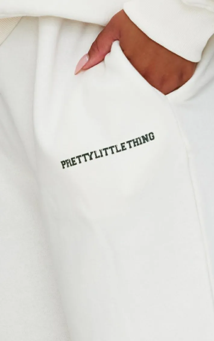 PRETTYLITTLETHING Plus Cream Contrast Print Wide Leg Sweatpants