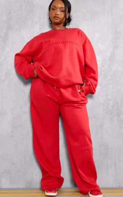 PRETTYLITTLETHING Plus Red Embossed Graphic Straight Leg Sweatpants