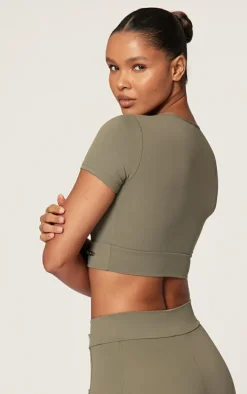 PRETTYLITTLETHING Sport Olive Metal Badge Sculpt Short Sleeve Top