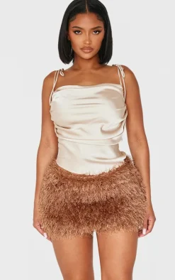 Shape Chocolate Low Rise Faux Leather Tassle Mini Skirt