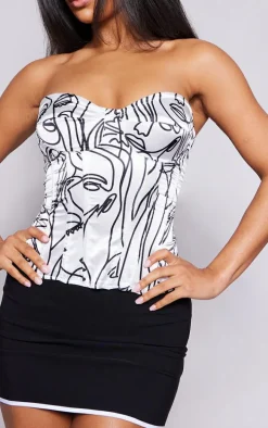 White Abstract Faces Print Satin Corset
